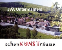 JVA Untermaßfeld Luftaufnahme mit Logo "schenK UNS Träume"